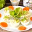 Яйца фаршированные икрой трески, морковью, сыром и листьями салата
