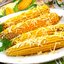 Варёная кукуруза с маслом и сыром