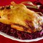 Запеченный гусь с каштанами, грушами и тушеной красной капустой